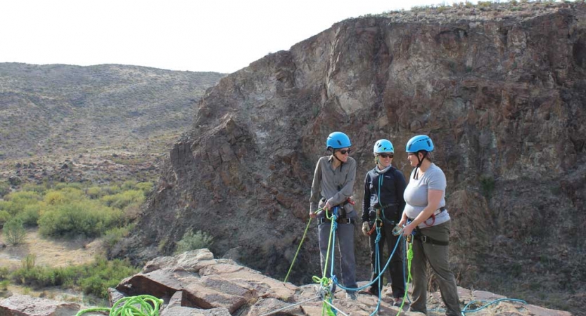 adults unplug on rock climbing course